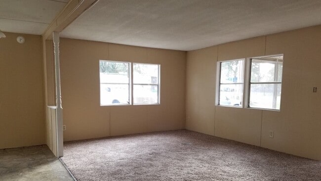 Photo - Freshly painted spacious 2-bedroom 1-bath home with a screened porch and storage shed.