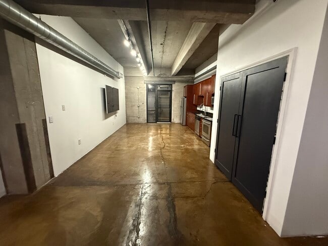Living room to kitchen - 360 W Pershing Rd Unit Liberty Loft 130