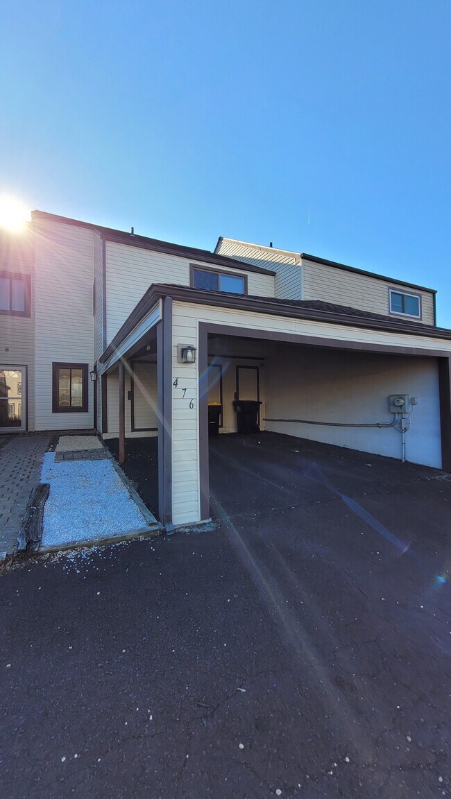 Front entry with carport - 476 Bridge St Townhome