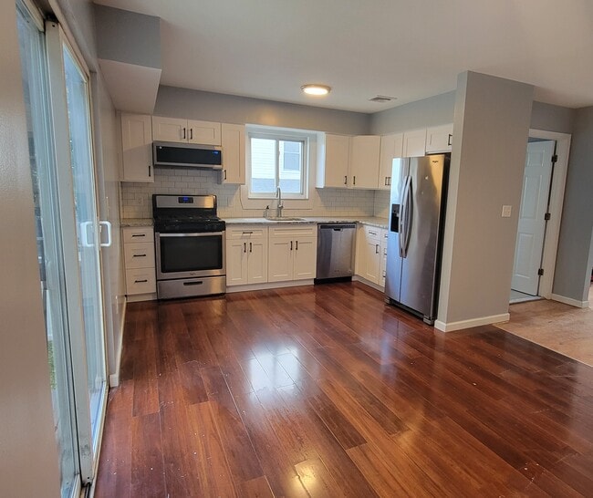 New cabinetry and granite counters to compliment stainless steel appliances - 103 Prescott Ave
