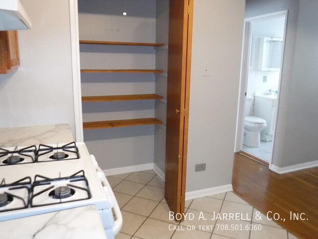 Building Photo - 8700 S Merrill Ave Unit 012 2A