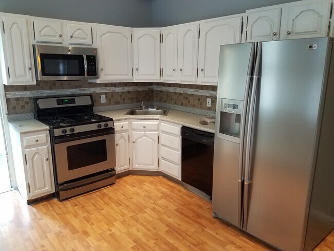 Kitchen with stainless appliances - 2508 E Lehigh Ave Townhome