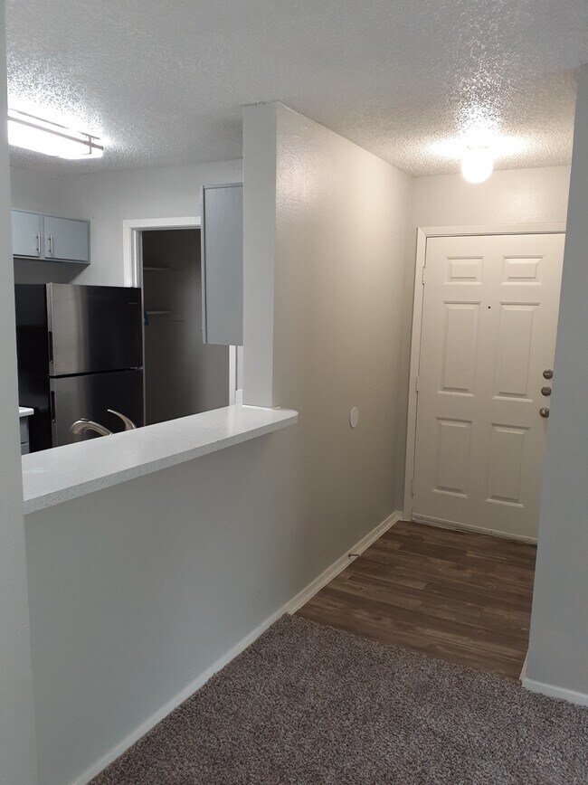 Upgraded Apartments with Faux Harwood Floor Front Door Thresholds