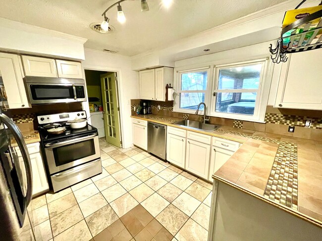 Photo - Spacious Home with Large Yard, Hot Tub, and More