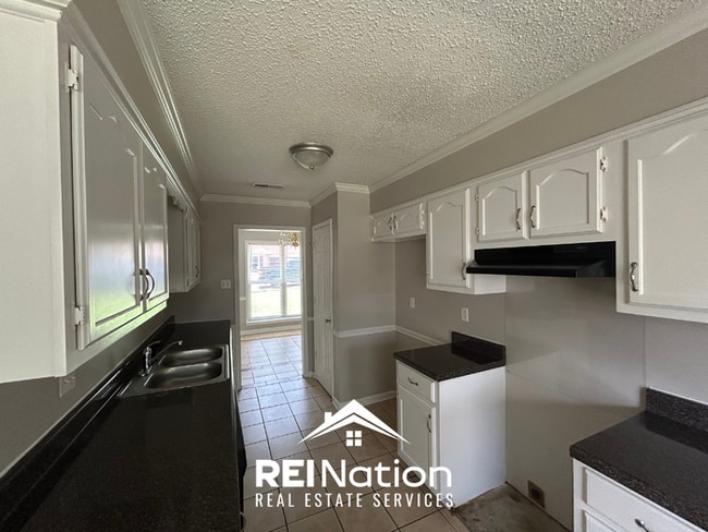 Spacious 4BR/2BA Near Southwind | High Ceilings, Brick Fireplace & 2-Car Garage