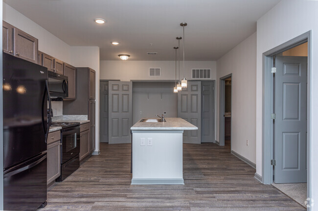 Spacious open island kitchen - Creekside at Adamsville Place Apartments