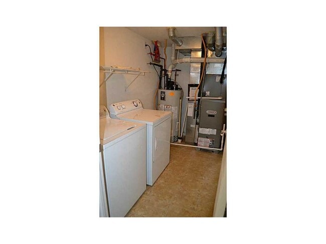 Lower Floor, Laundry Room. Before Garage. - 12668 Hollice Ln