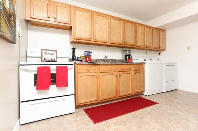2BR, 1BA - 944 SF - Kitchen With Laundry - Eleven Oaks Apartments