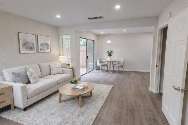 Spacious living room with an open-concept design that opens directly to the kitchen. Virtually stage - 5917 Little Creek Trl