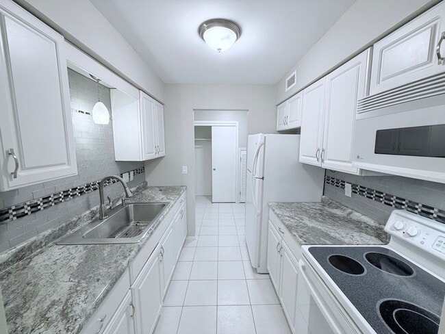 Photo - Large 1BR Condo with Patio, Heated Parking, Pool, Sauna & Tennis Courts!