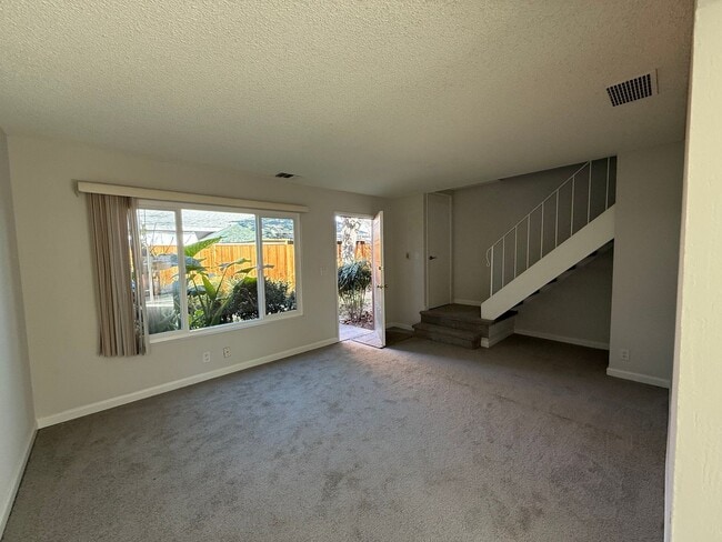 Photo - Quiet unit with new paint, new carpet, new windows and Air Conditioning!