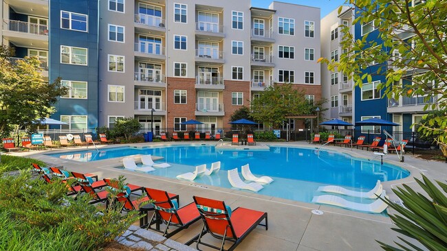 Resort-style swimming pool with cabanas
