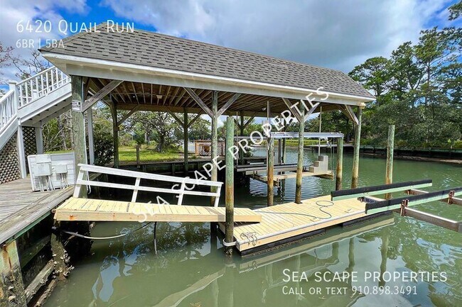 Photo - 60 ft floating dock, two 36f covered boat...