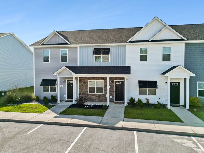 Photo - Available Now! Enjoy low-maintenance coastal living in this beautiful 2-bedroom, 2.5-bath townhom...