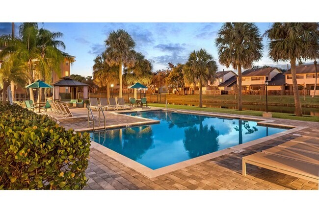 Relax poolside at Midora at Woodmont in Tamarac, FL - Midora at Woodmont Rental