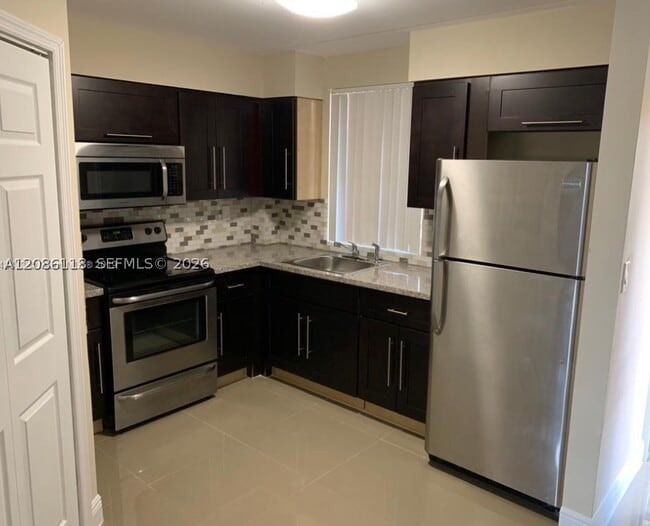 Building Photo - 6175 NW 186th St Unit 305