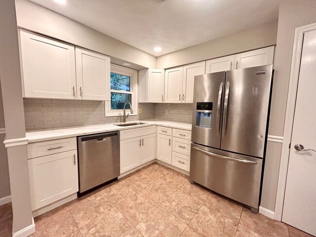 Photo - Spacious 4-Bedroom Home with Large Yard & Garage!