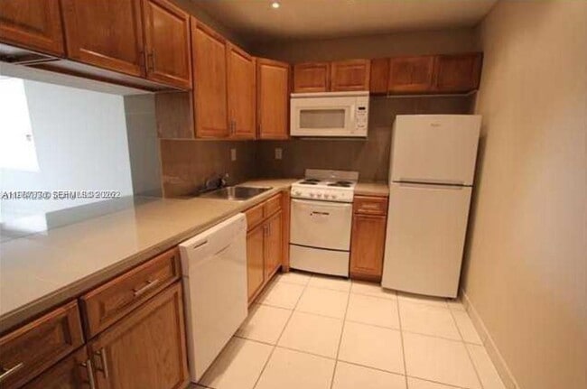 Building Photo - 5775 W 20th Ave Unit 406