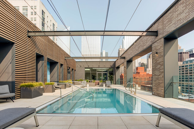 Dive into relaxation—poolside perfection awaits. - Emme Rental