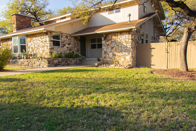 Front yard of the home with easy access to backyard - 100 Beaver St House Unit A