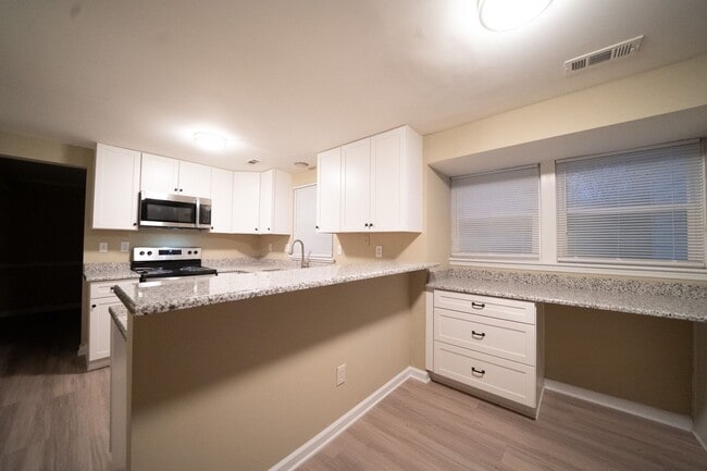 Photo - Remodeled 2 sty 4 bd, 2 1/2 ba 2 car gar fenced yd 6 ,9, or 12 mo lease