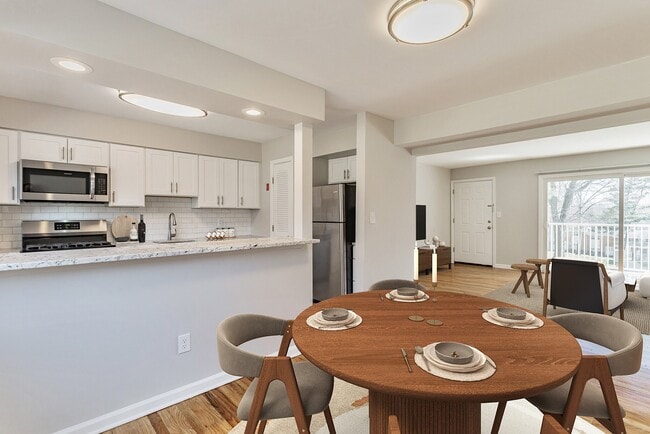 Elevate your lifestyle at Eagle Rock Apartments at North Plainfield. This stunning modern kitchen and dining area are perfect for entertaining. Enjoy spacious living with contemporary finishes. Schedule your tour today and see for yourself!