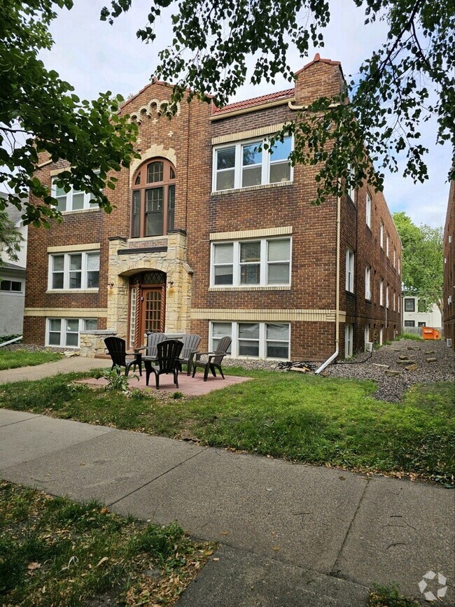 Front of Building with Patio - 3117 Colfax Ave S Rental