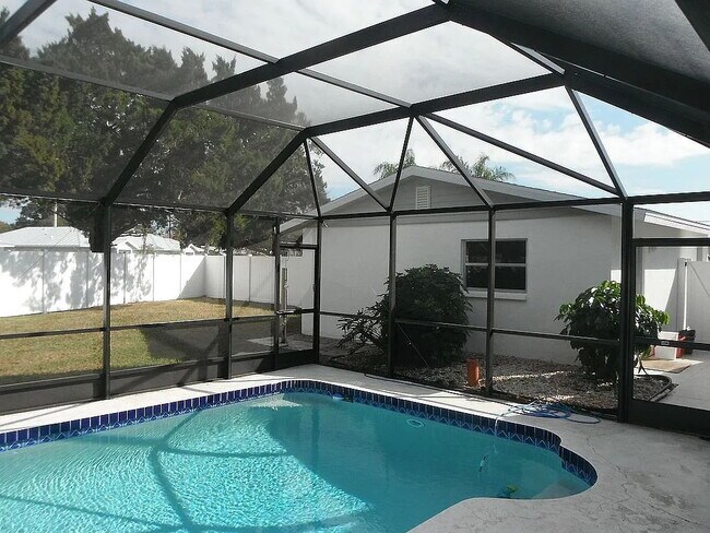 Photo - 4-Bedroom Pool Home with 2 Full Baths - Spacious 2373 Sq Ft Home in Englewood's Prime Location!"