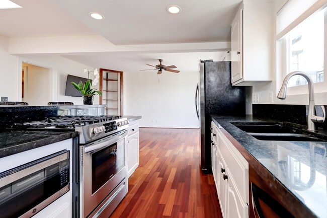 Hardwood floors throughout the great room and kitchen. - 744 12th St Unidad 744 12th St