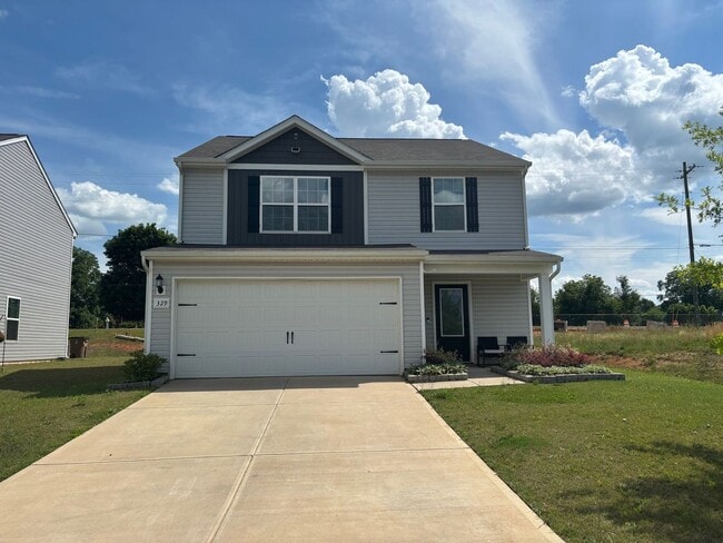 Building Photo - Beautiful 4 Bedroom 2.5 Bath House with Fenced Yard Available!   Pet Friendly!
