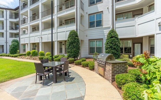 Outdoor Entertainment Space with FireplaceRiverhouse Apartments in Little Rock, Arkansas