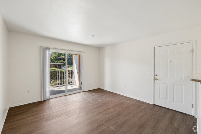 4BR, 2BA - 1,217SF - Living Room - El Palmar Apartments