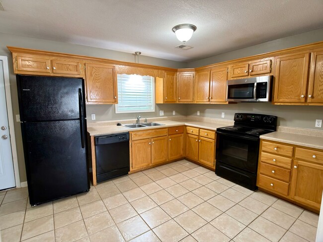 Photo - 3 Bed, 2 Bath Home with Fenced Backyard and 2-Car Garage in Brookland
