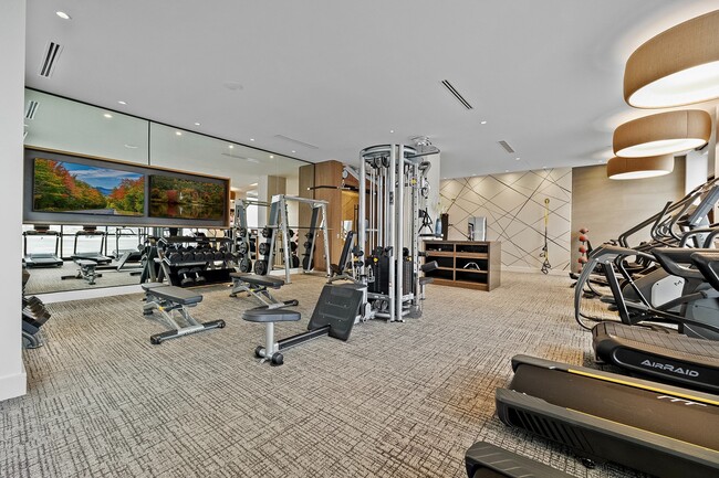 Fitness center with cardio and strength machines - Hanover Toscana Apartments