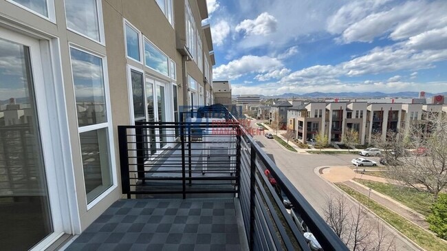 Building Photo - 7240 W Custer Ave Unit 411