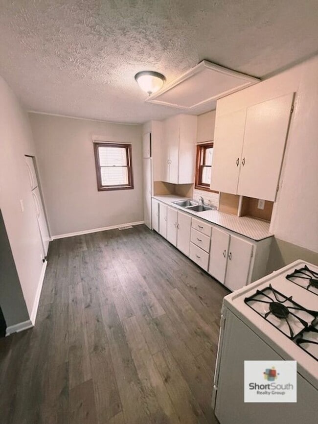 Photo - Updated 2 bed 1 bath main floor apartment with covered detached garage