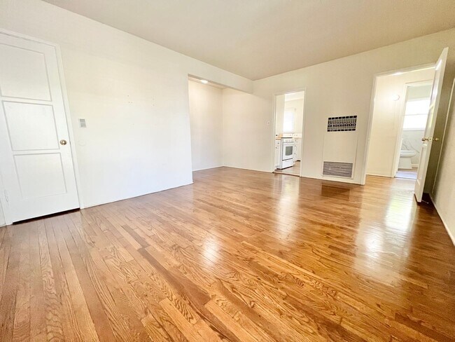 Building Photo - Charming 2-Bedroom Home with Hardwood Floors & Fireplace Near the Traffic Circle Unit 4510 E 15th St