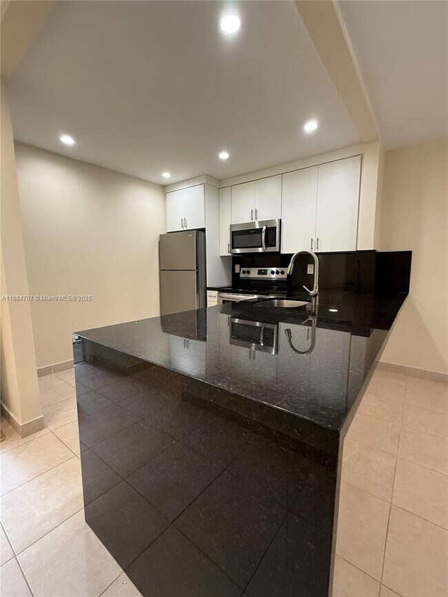 Building Photo - 8101 Camino Real Unit C220 Rental