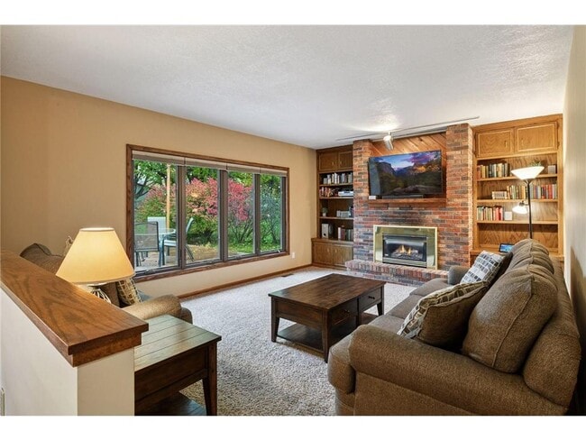 Main floor family room with gas fireplace - 9933 Balmoral Ln