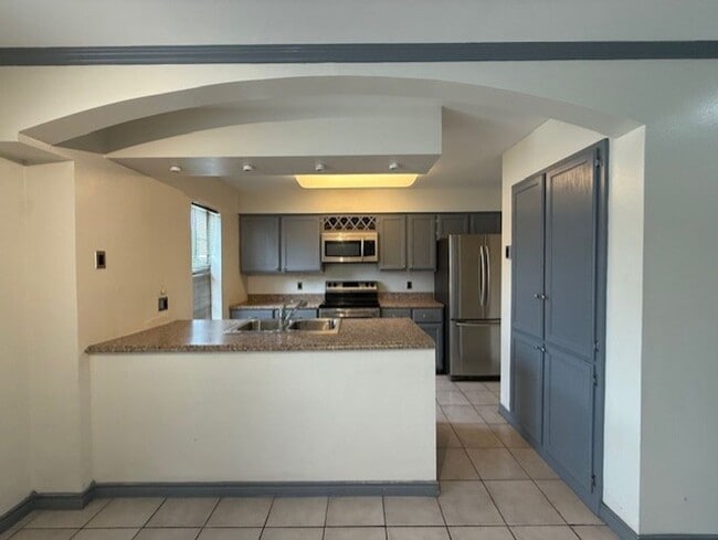 Photo - Downstairs -Three-bedroom Condo Unit K
