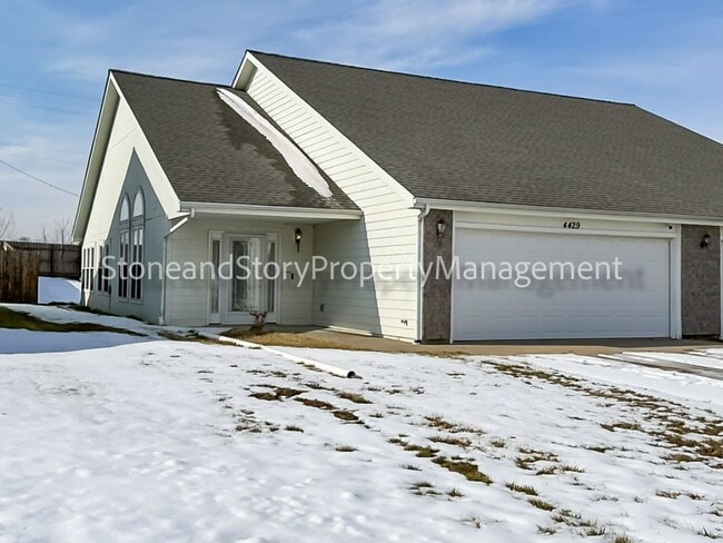 Photo - 2 bedroom 1.5 bath duplex with sunroom, 2 car garage and fenced yard