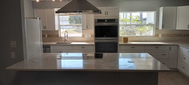 Photo - 5-Bedroom Pool Home with 2 Full Baths - Spacious 2373 Sq Ft Home in Englewood's Prime Location!"