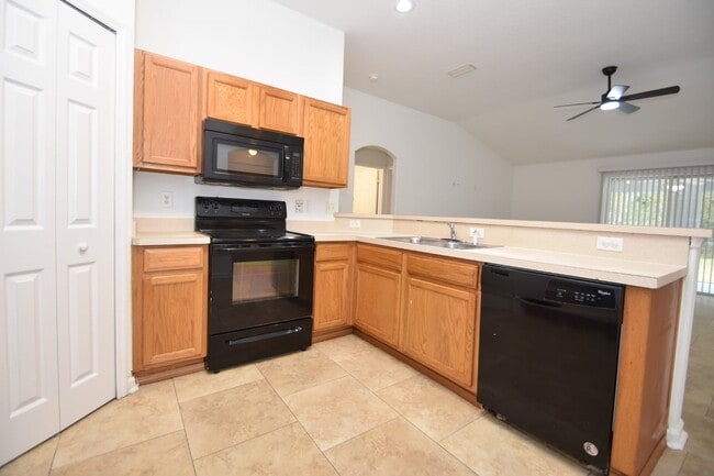 Photo - Fenced yard at this spacious 4-Bedroom Oasis with 2 Baths in Charming Palm Coast Retreat!