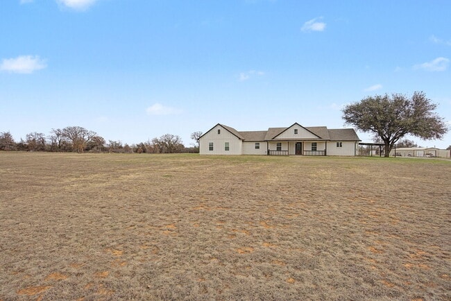 Building Photo - “Farmhouse Charm Meets Modern Luxury on a Serene 5-Acre Lot!”