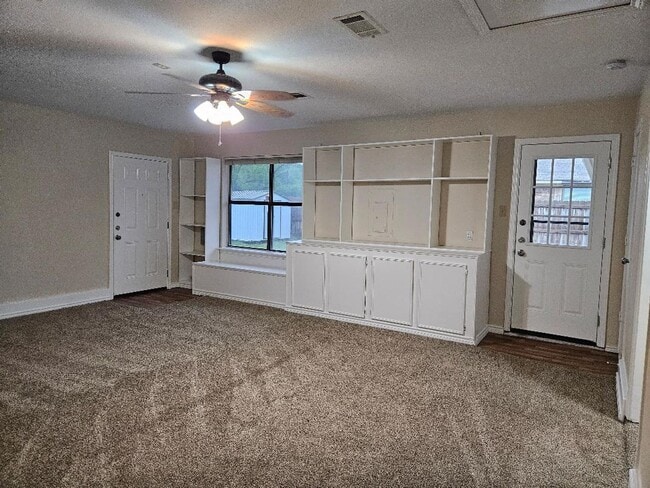 Photo - Three bedroom and two bathroom nicely remodeled with new flooring. Large wood fenced backyard