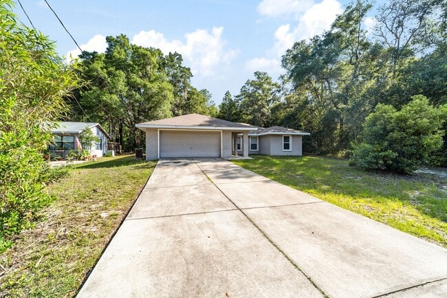 Photo - Peaceful 3-Bedroom Home with Open Floor Plan & Two-Car Garage in Rainbow Lakes Estates!