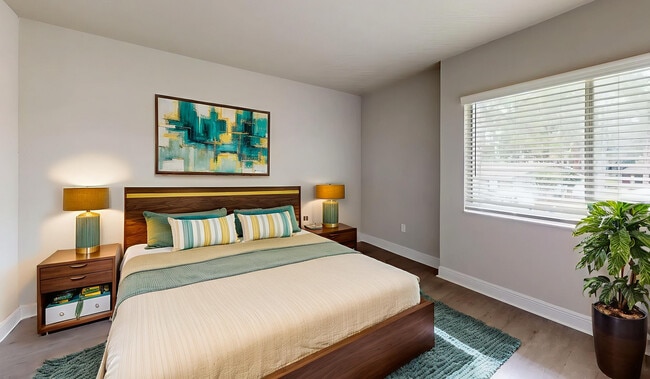 Bright and modern bedroom with stylish decor, featuring a cozy bed, elegant lamps, and vibrant wall art. - Soto Apartments