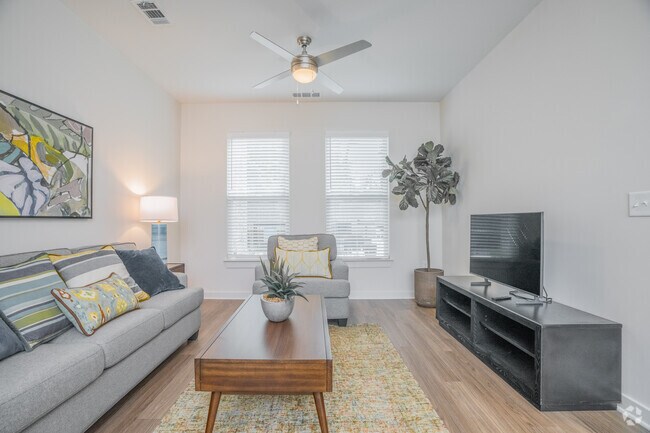 1BR, 1BA - 650SF - Living Room - Alexis Parc 55+ Active Adult