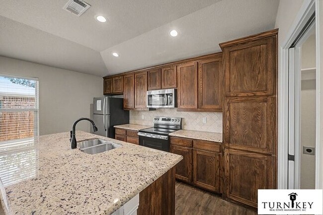 Photo - COMING SOON! 3BD/2BA Energy-Efficient Duplex | Granite | Island Kitchen | Garage | Yard Care Incl...