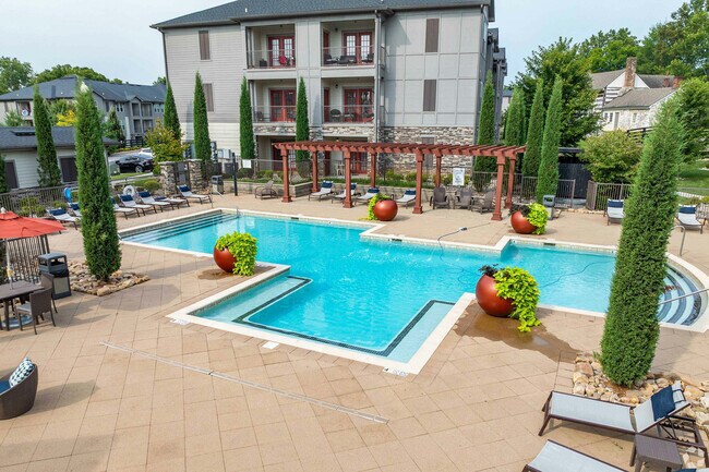 Experience relaxation and elegance at our exquisite poolside retreat. - Springhouse